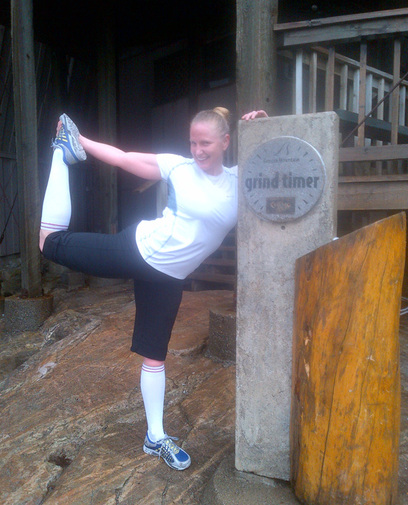 Jodi Eckland, stretching at the top of the Grouse Grind