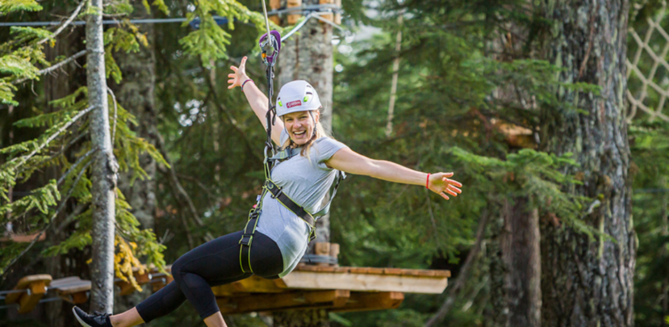 Ziplining on the new Mountain Ropes Adventure, aerial ropes course at Grouse Mountain